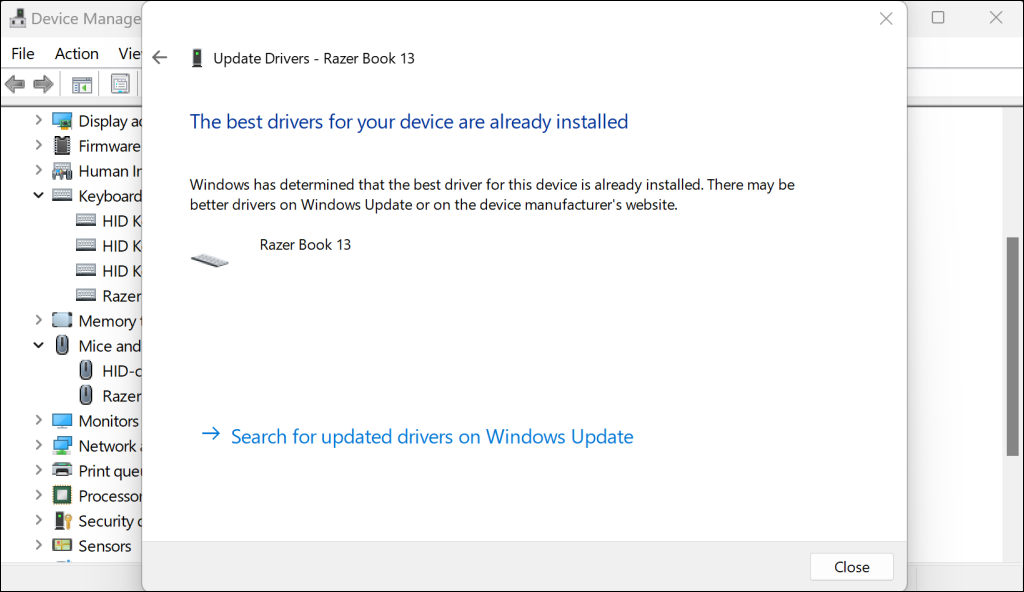 Driver update window in Device Manager with a "The best drivers for your device are already installed" message.
