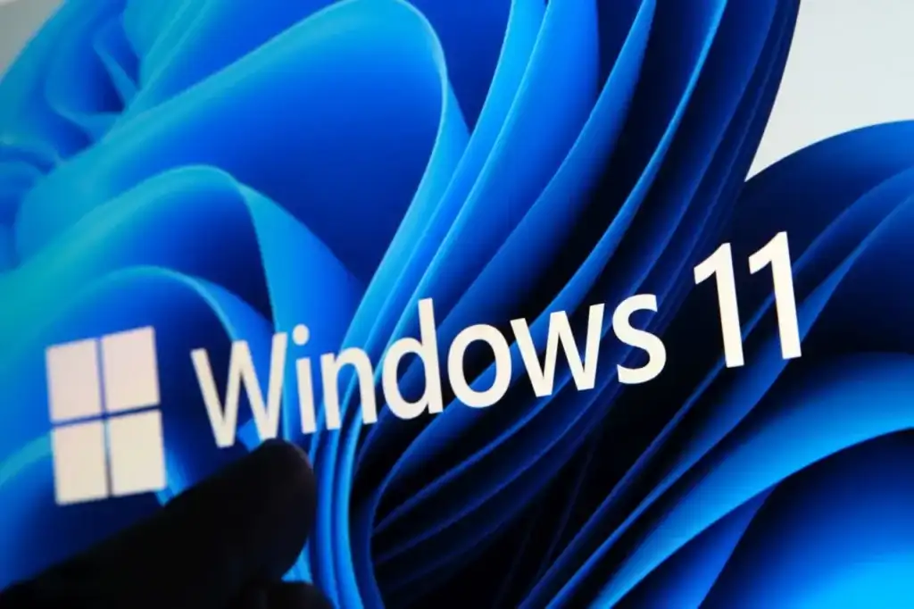 Windows 11 logo on stylized desktop background