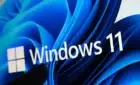 Windows 11 logo on stylized desktop background