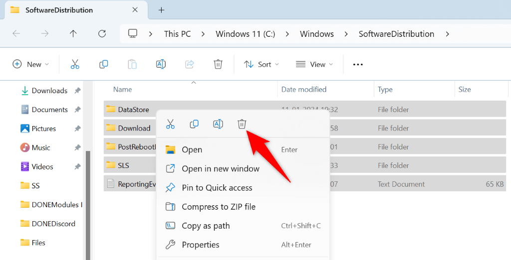 The trash can icon highlighted for the selected Windows Update files in File Explorer.