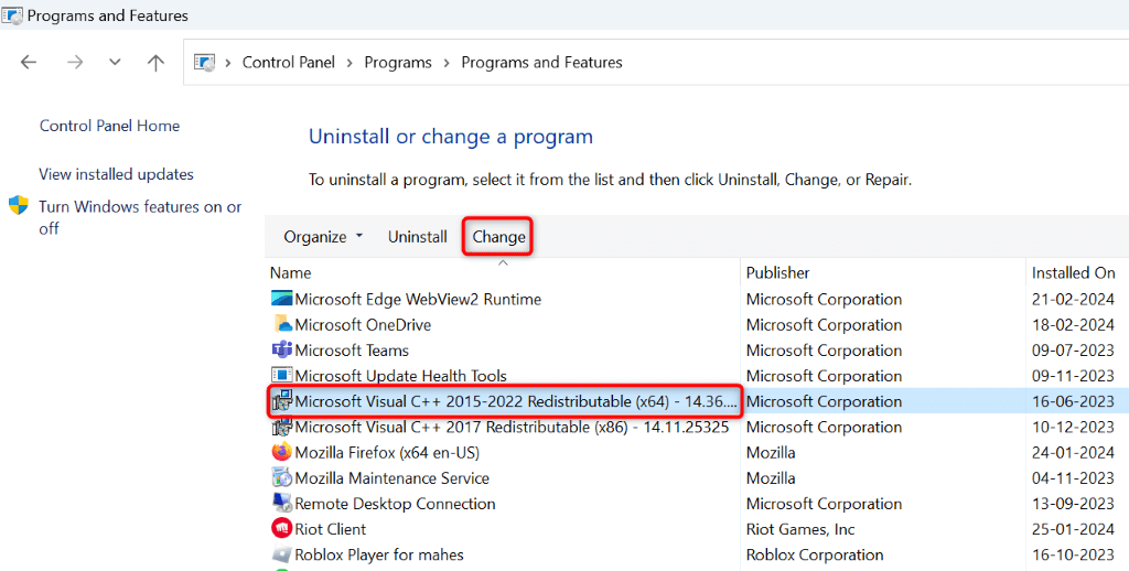 A Microsoft Visual C++ Redistributable package and "Change" highlighted in Control Panel.