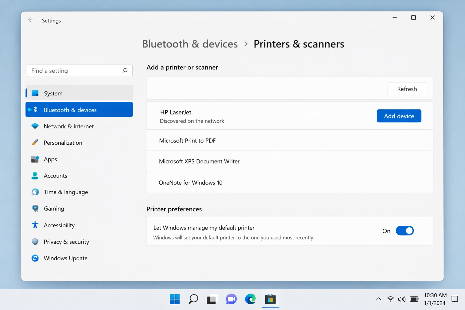 Windows 11 Printers & scanners page showing a discovered network printer listed with an 