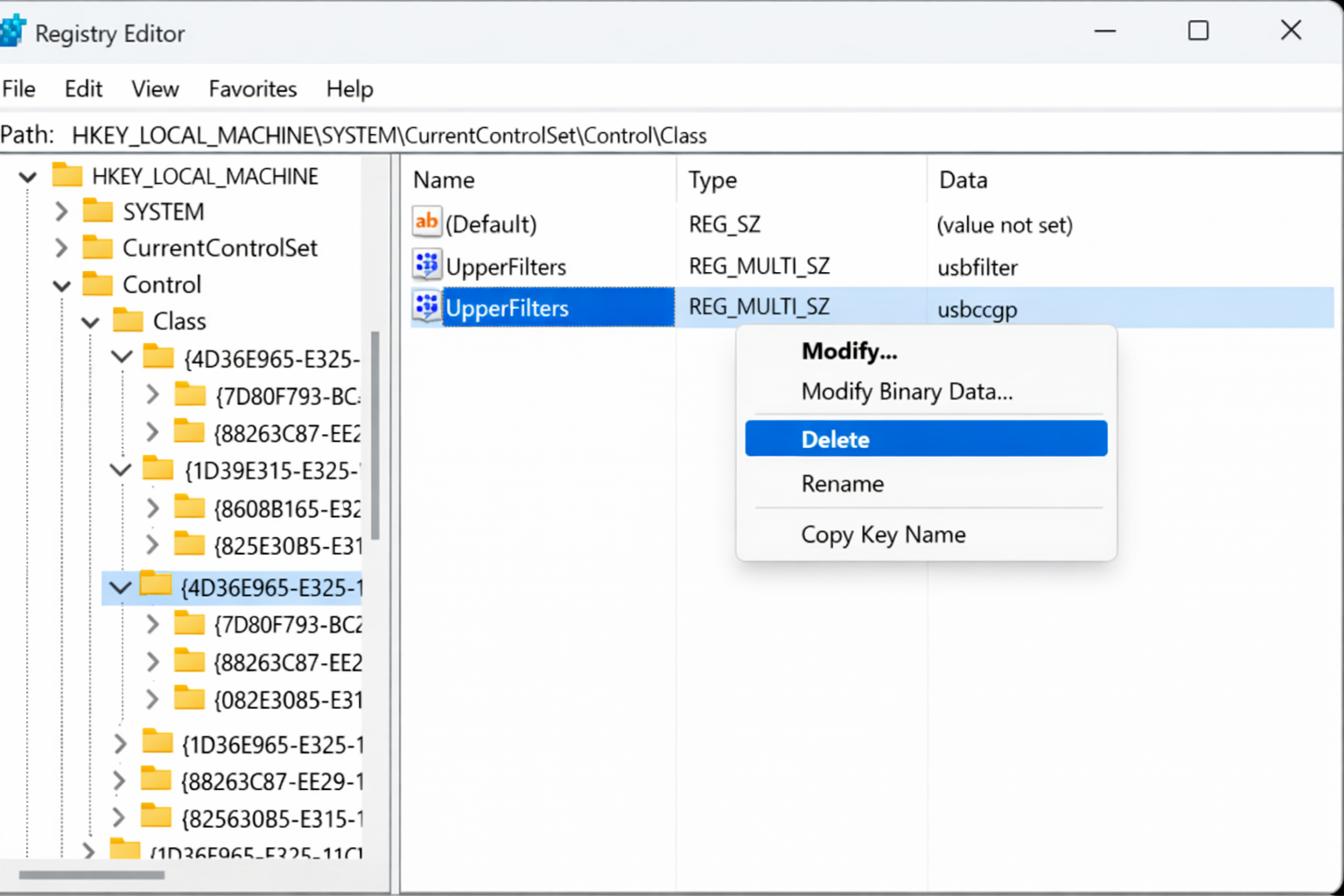 Registry Editor open at HKEY_LOCAL_MACHINE\SYSTEM\CurrentControlSet\Control\Class showing UpperFilters value in the right pane with right-click context menu showing Delete