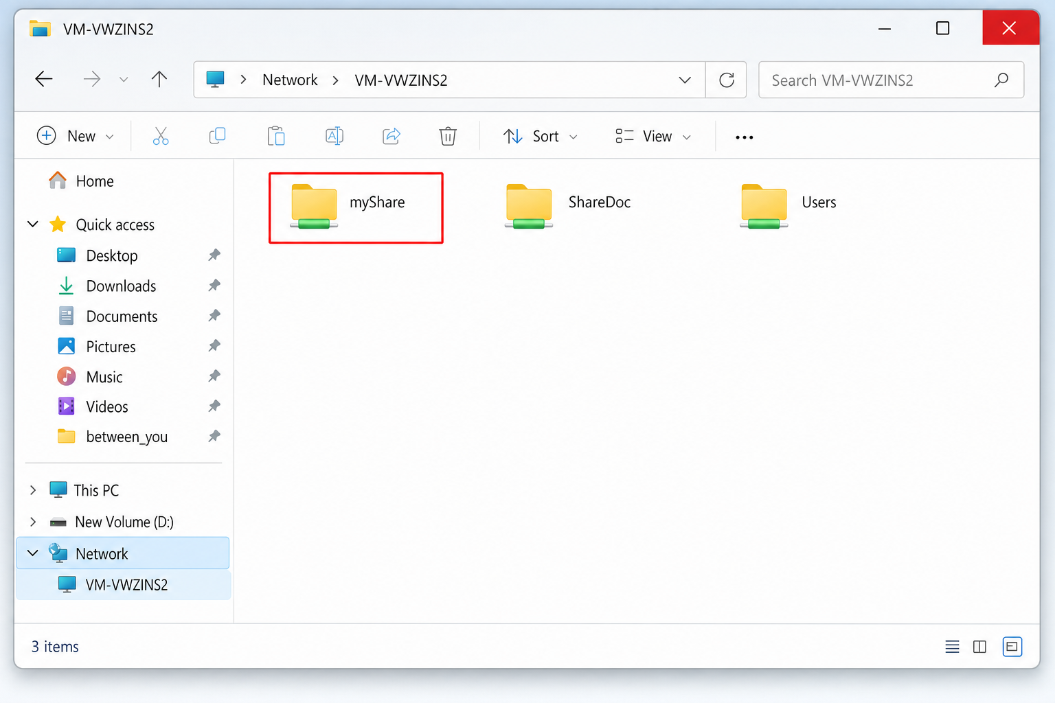 Windows 11 File Explorer showing the Network section in the left sidebar with a second computer visible and its shared folder open