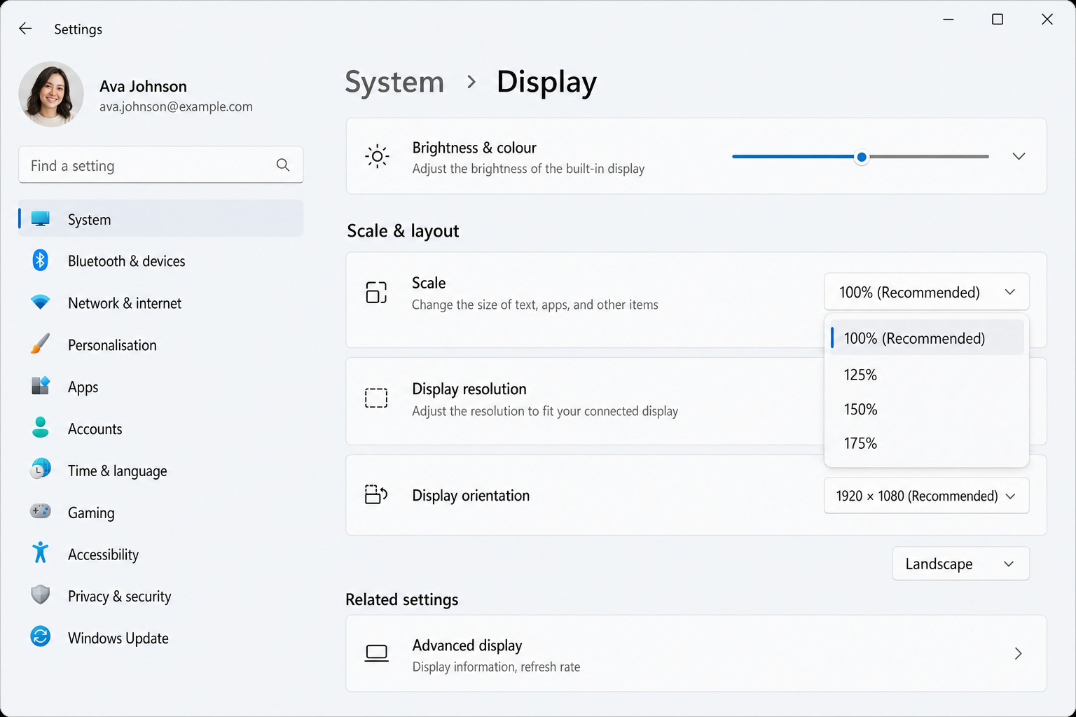Windows 11 Settings > System > Display showing the Scale dropdown under Scale & layout