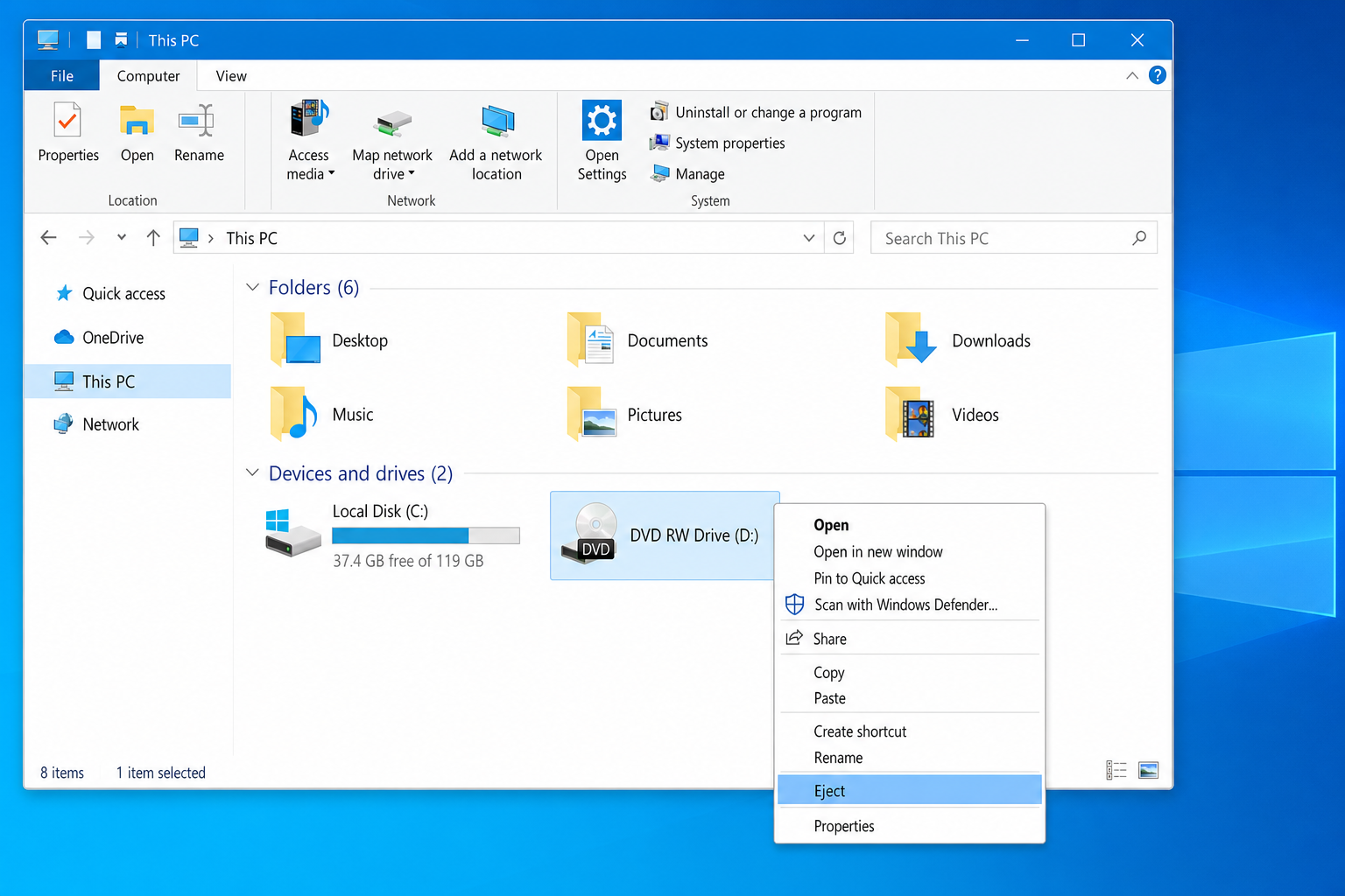 File Explorer showing This PC with a DVD drive listed, right-click context menu open with Eject highlighted