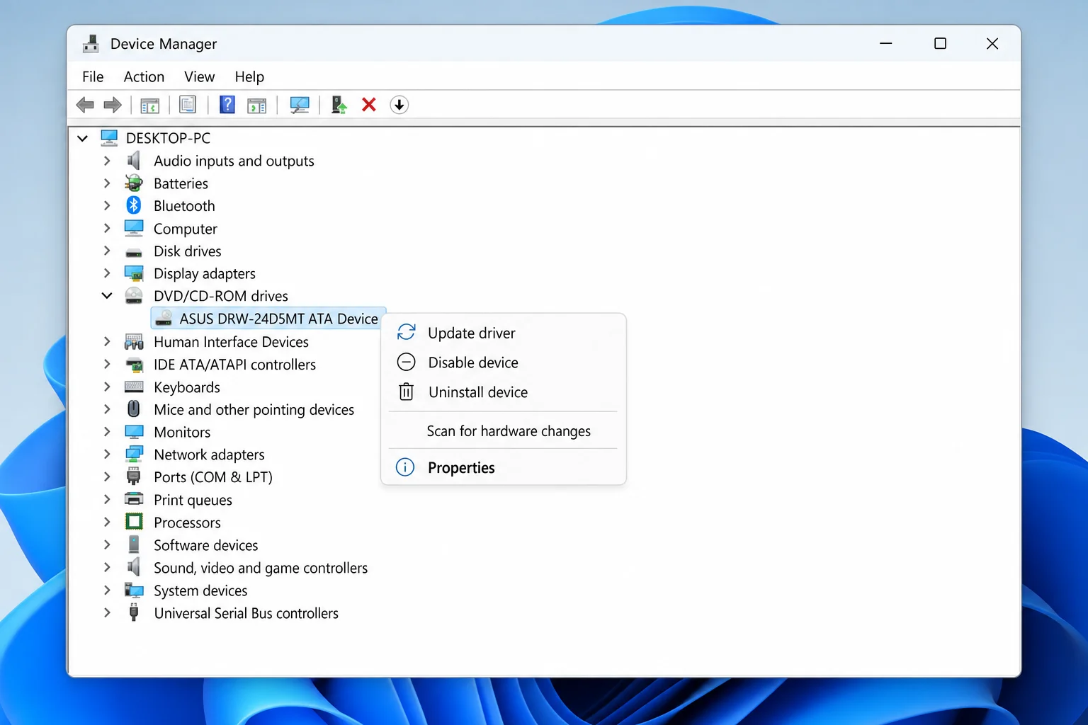 Windows 11 Device Manager window with the "DVD/CD-ROM drives" category expanded, showing a DVD drive entry right-clicked to reveal a context menu with Update driver, Disable device, Uninstall device, and Properties. Clean legible UI, correctly spelled labels, no garbled text.