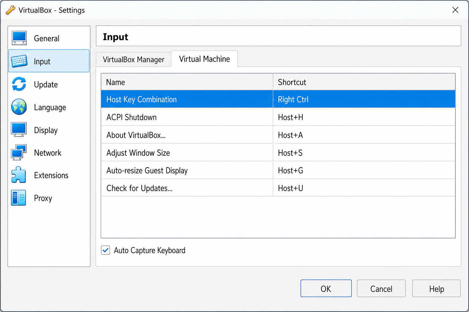 VirtualBox Preferences window open on the Input tab, showing the Virtual Machine section with the Host Key Combination shortcut field highlighted