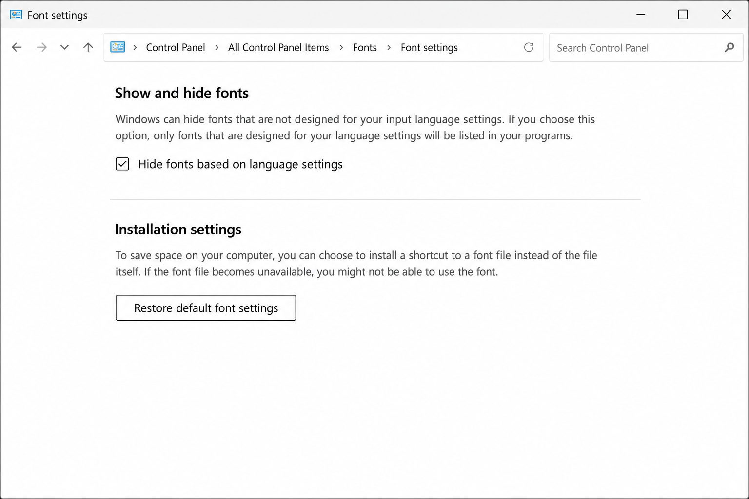 Control Panel Font Settings dialog showing the "Restore default font settings" button