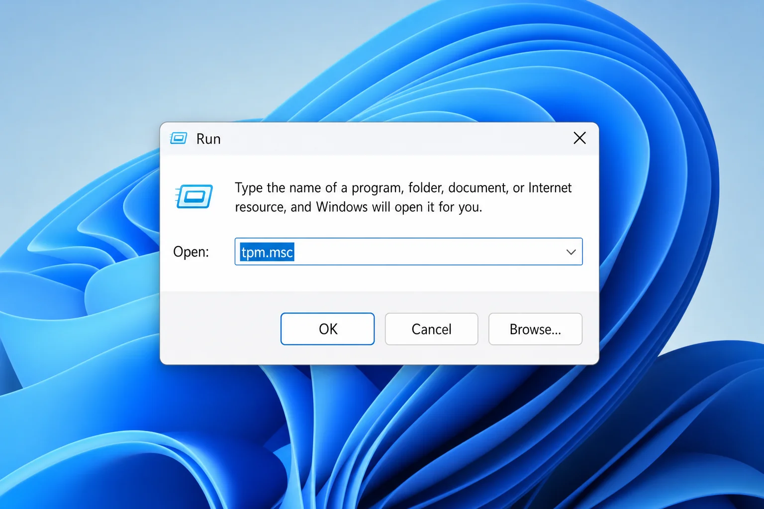 Windows 11 Run dialog with 'tpm.msc' typed in the Open field, OK button visible
