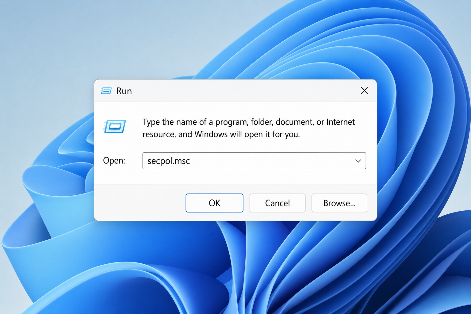 Windows 11 Run dialog with secpol.msc typed in the Open field
