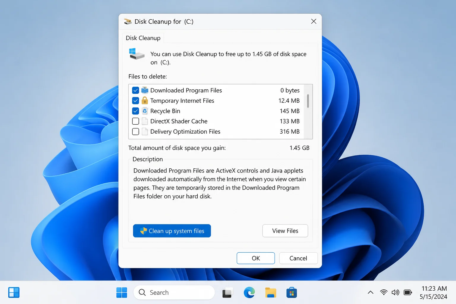 Disk Cleanup dialog on Windows 11 with the "Clean up system files" button highlighted at the bottom of the dialog
