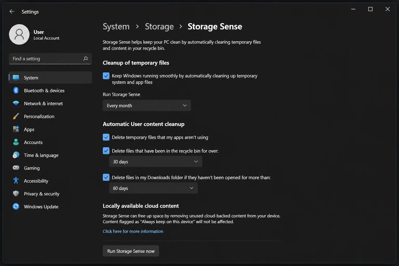 Windows 11 Storage Sense configuration page showing cleanup schedule dropdown set to "Every month" and the "Run Storage