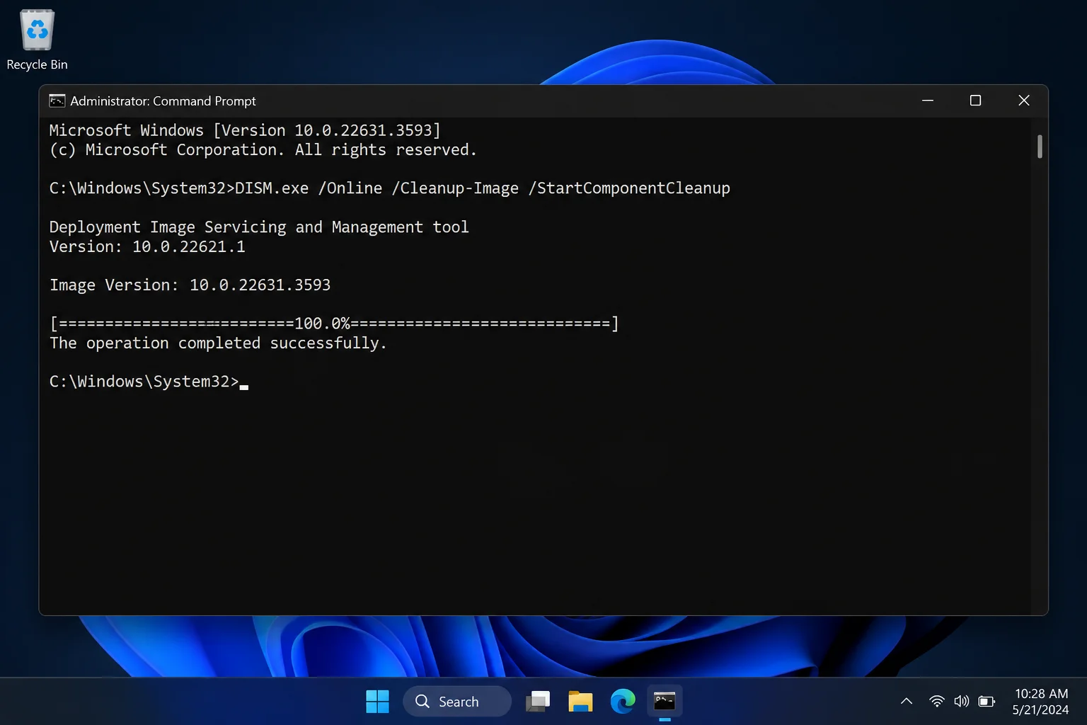 Elevated Command Prompt on Windows 11 showing DISM.exe /Online /Cleanup-Image /StartComponentCleanup running with "The