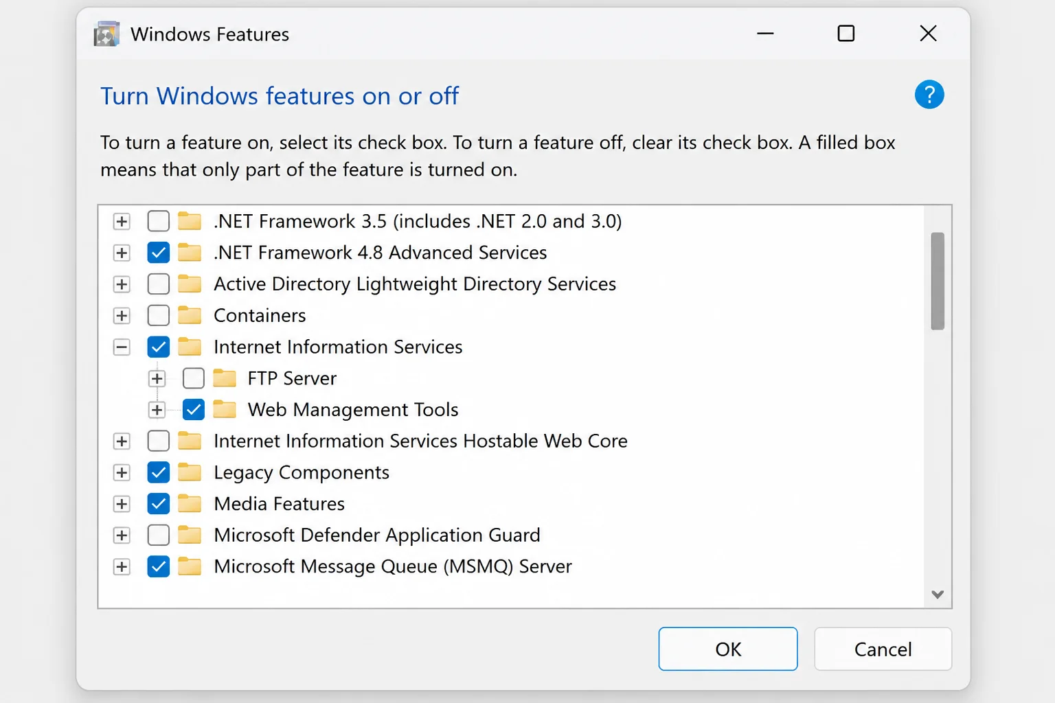 Turn Windows features on or off dialog on Windows 11 showing a scrollable list of optional features with checkboxes in