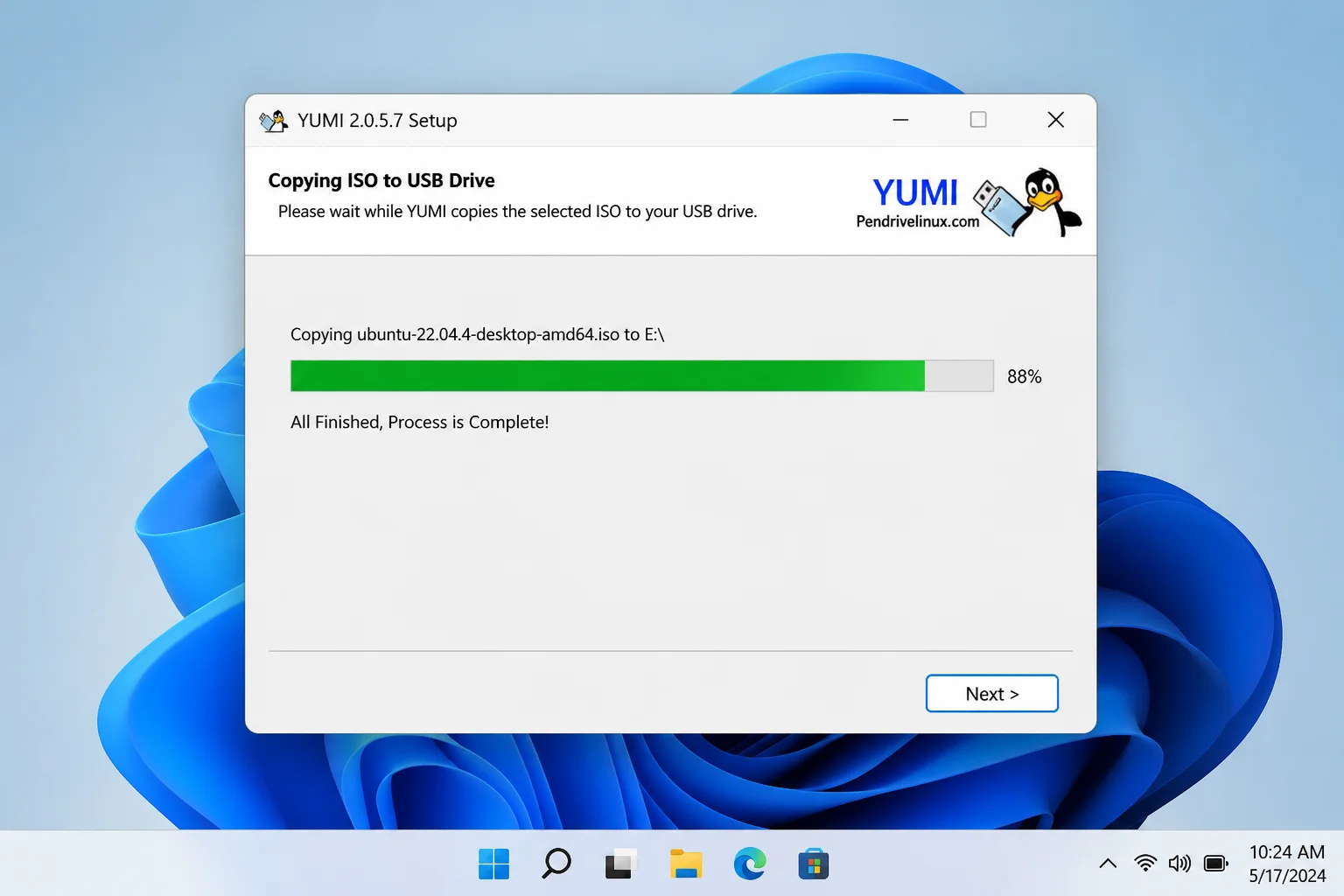 YUMI progress dialog showing the ISO being processed and copied to the USB drive