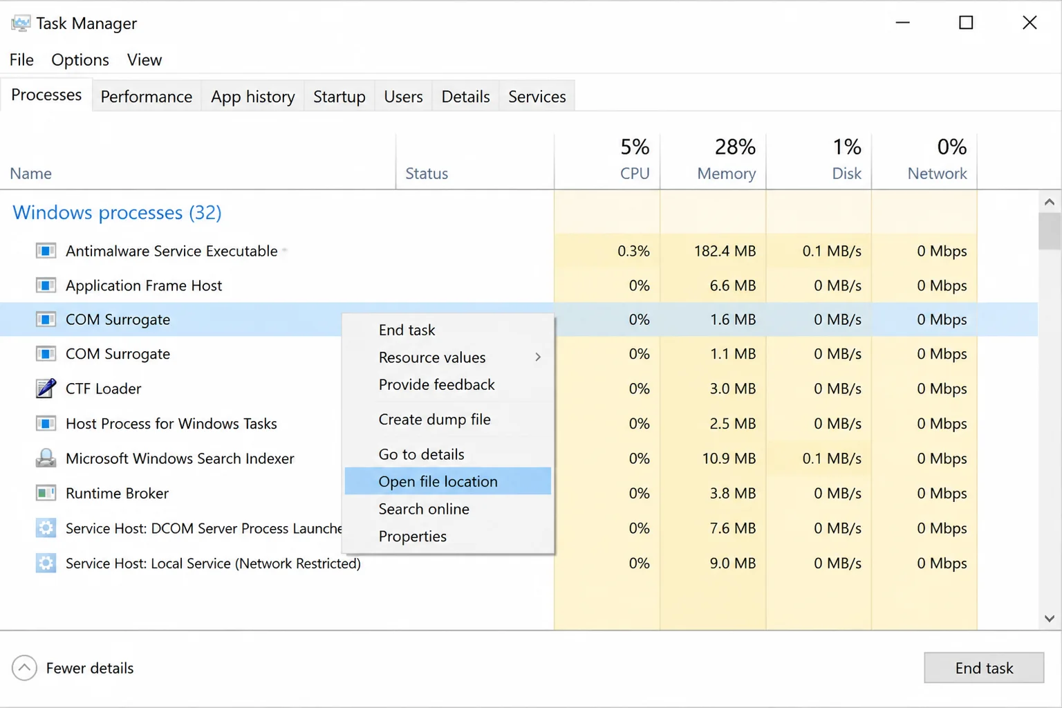 Task Manager Processes tab with COM Surrogate right-clicked and "Open file location" highlighted in the context menu