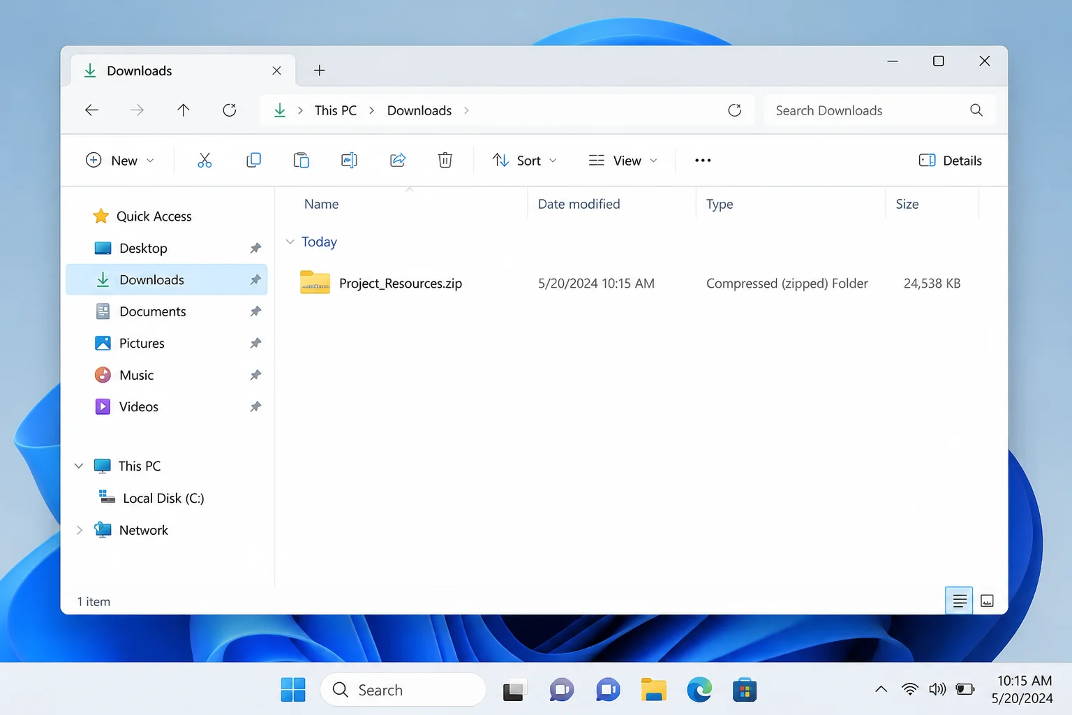 Windows 11 File Explorer open to the Downloads folder with a ZIP file visible