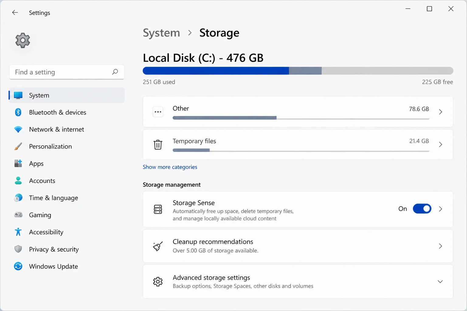 Windows 11 Settings > System > Storage page showing the Storage Sense toggle set to On and the Cleanup recommendations link