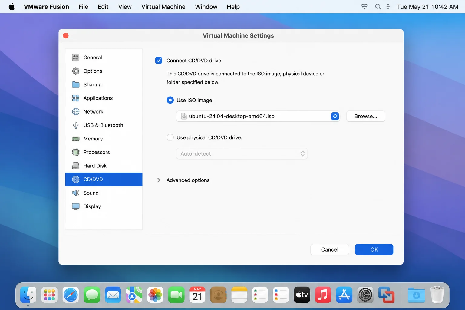 VMware Fusion Virtual Machine Settings window showing the CD/DVD pane with "Connect CD/DVD drive" checked and a specific ISO