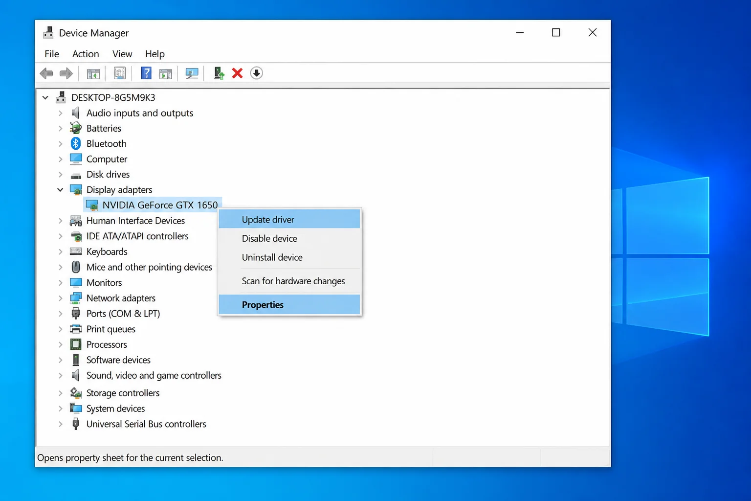 Device Manager window with the Display adapters category expanded, showing the right-click context menu with Update driver and Properties options