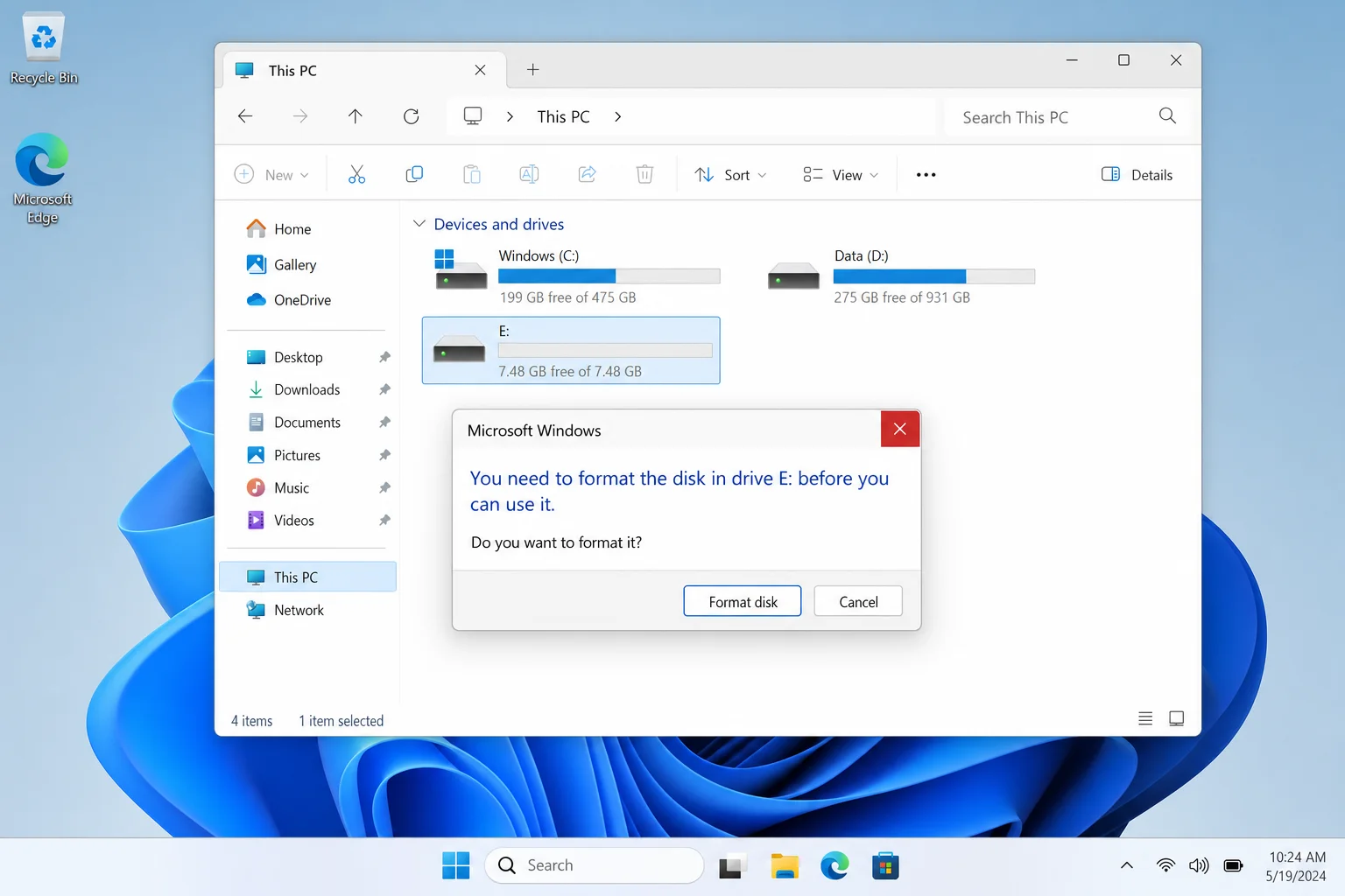 Windows 11 "You need to format the disk in drive E: before you can use it" dialog with Format disk and Cancel buttons visible