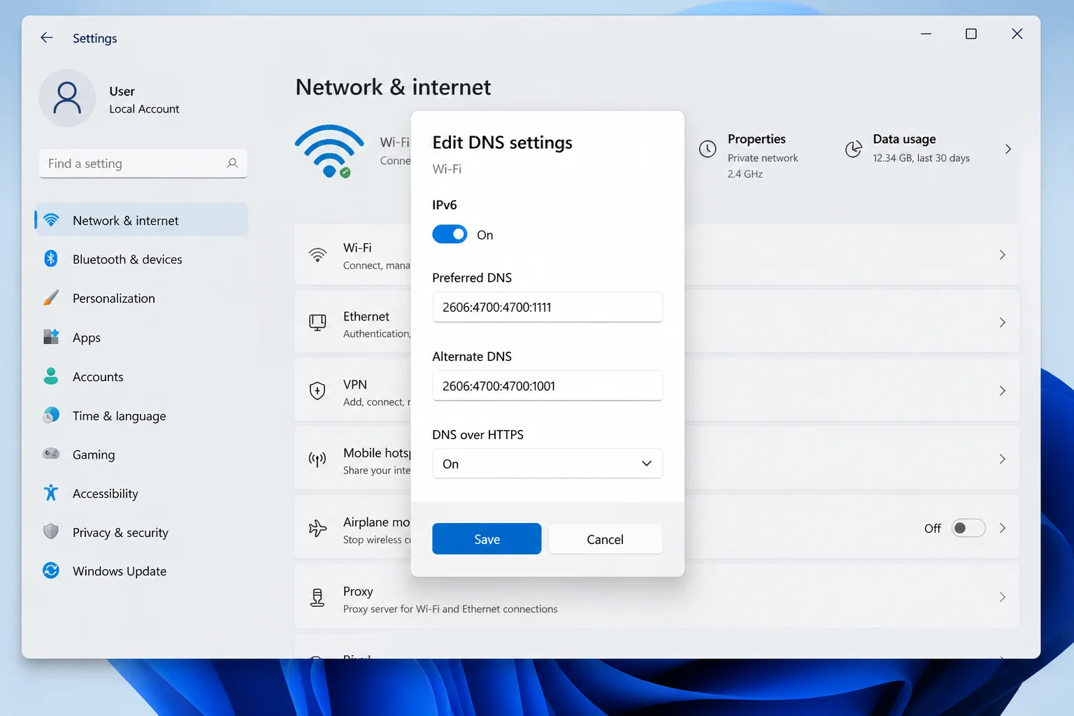Windows 11 Edit DNS settings dialog showing Cloudflare addresses with DNS over HTTPS enabled