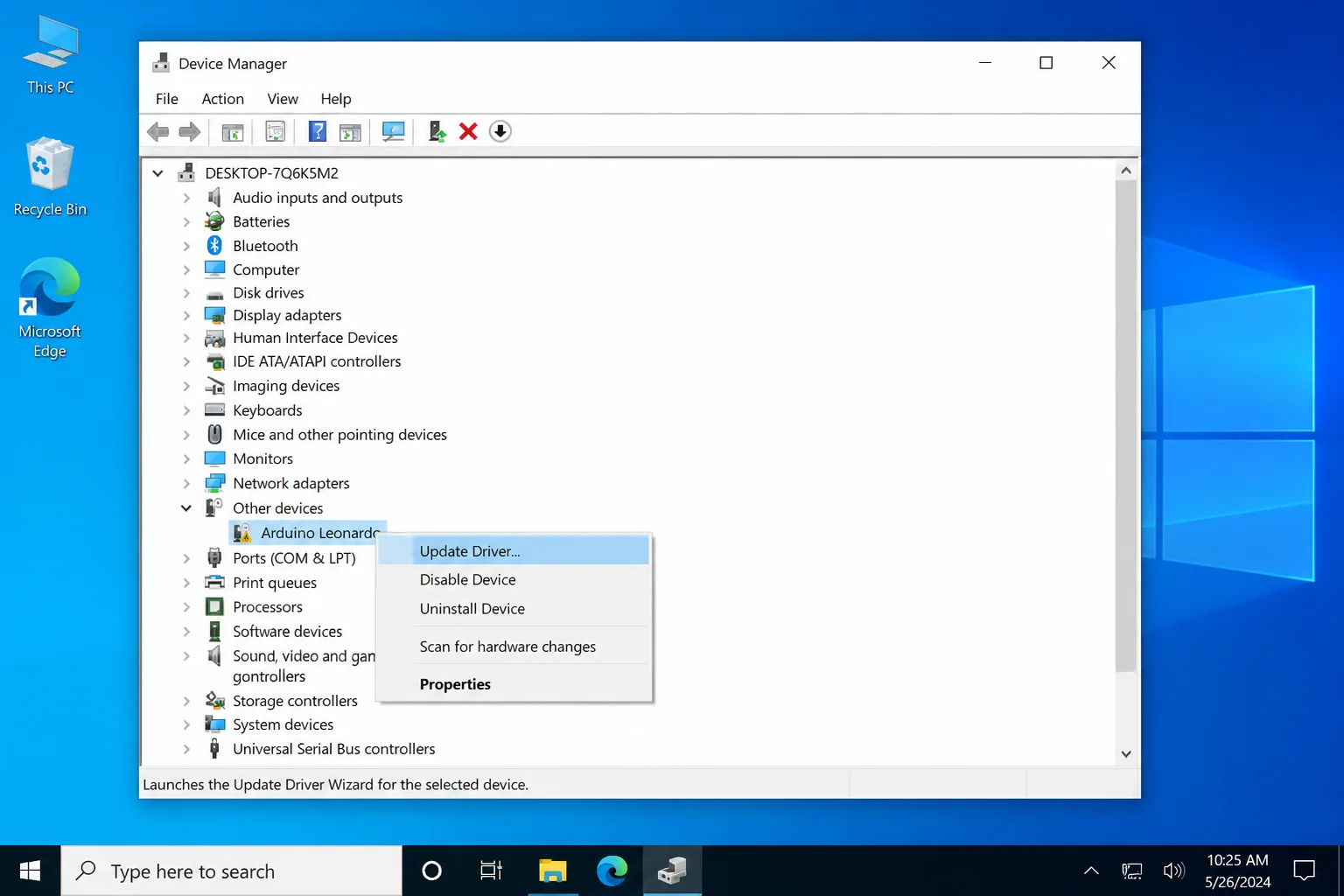Device Manager open showing a device with a yellow warning triangle under the Bluetooth section, with the right-click context menu open and "Update driver" highlighted