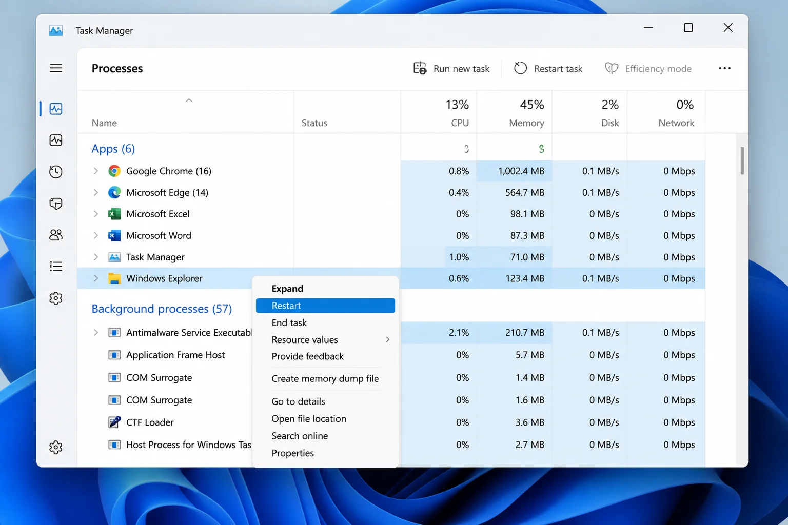 Task Manager Processes page with Windows Explorer selected and Restart task highlighted