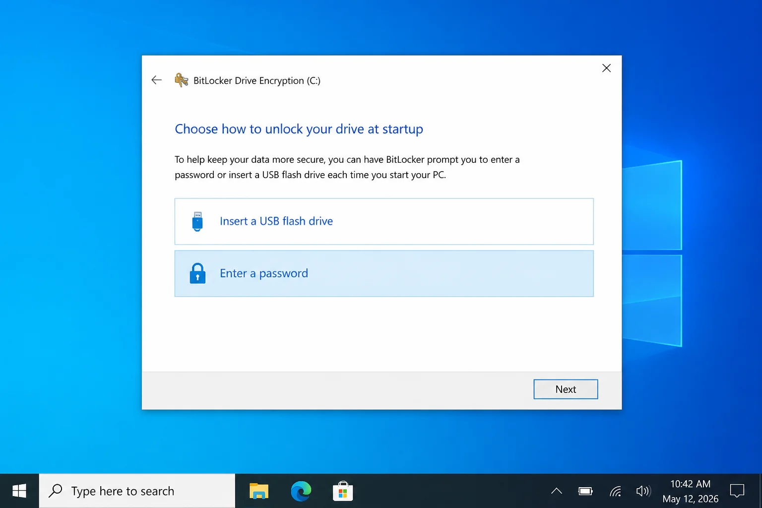 BitLocker Drive Encryption setup wizard prompting to enter a password or insert a USB flash drive for startup authentication, with Next button visible