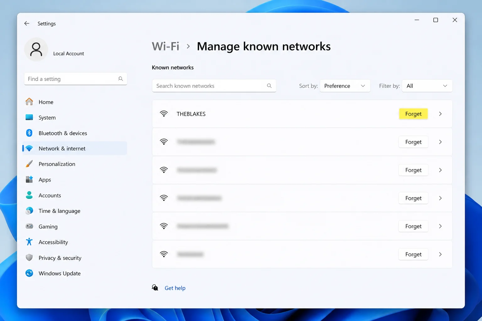 Manage known networks page with the Forget control highlighted and personal network names blurred