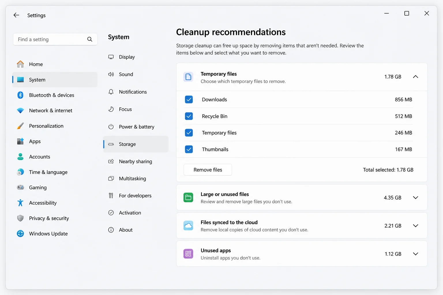 Windows 11 Cleanup recommendations page showing Temporary files, Large or unused files, Files synced to the cloud, and Unused apps