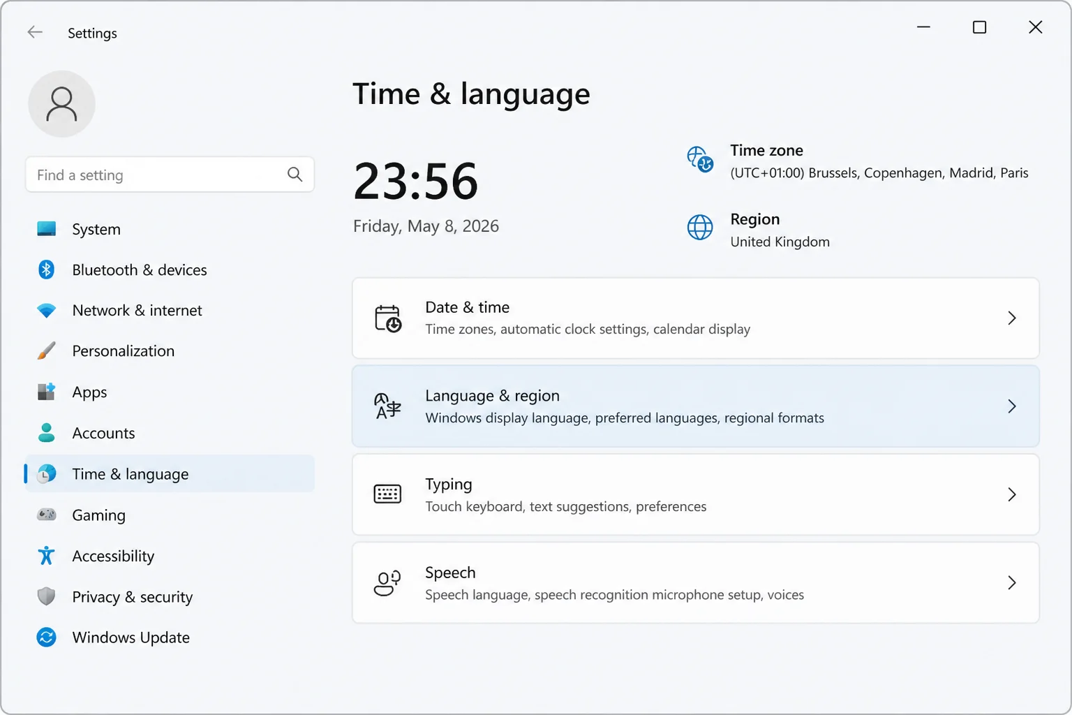 Windows 11 Settings > Time & language page with Language & region highlighted