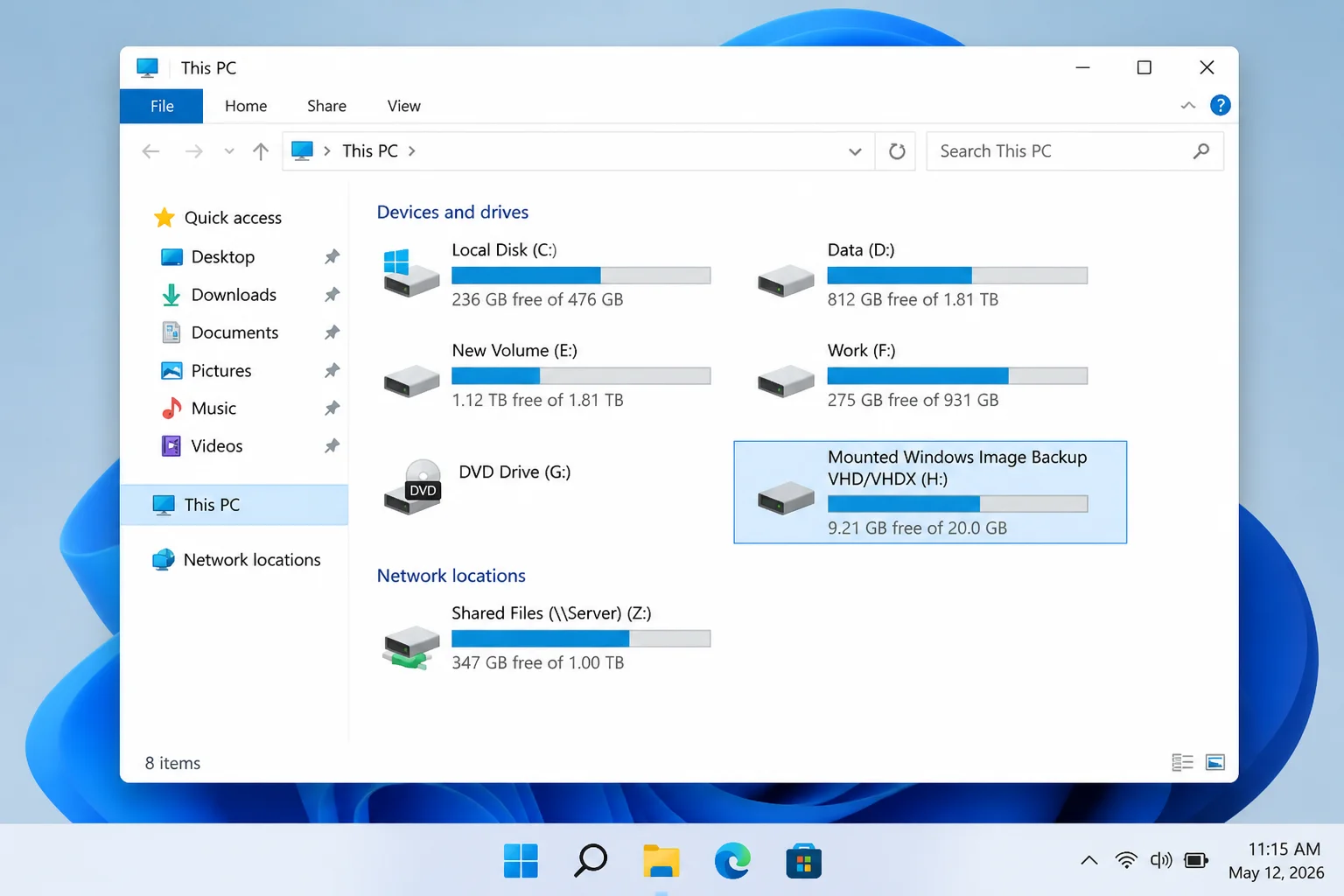 Windows 11 File Explorer This PC view showing the mounted VHDX as a separate drive