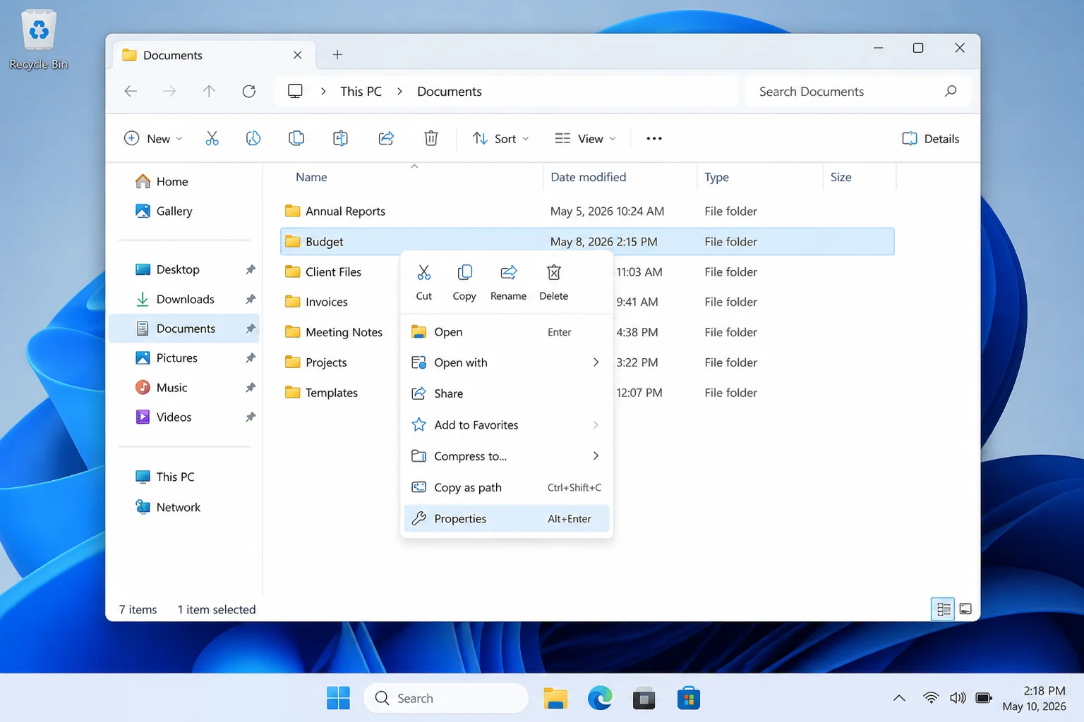 Windows 11 File Explorer with a folder right-clicked and Properties highlighted in the context menu