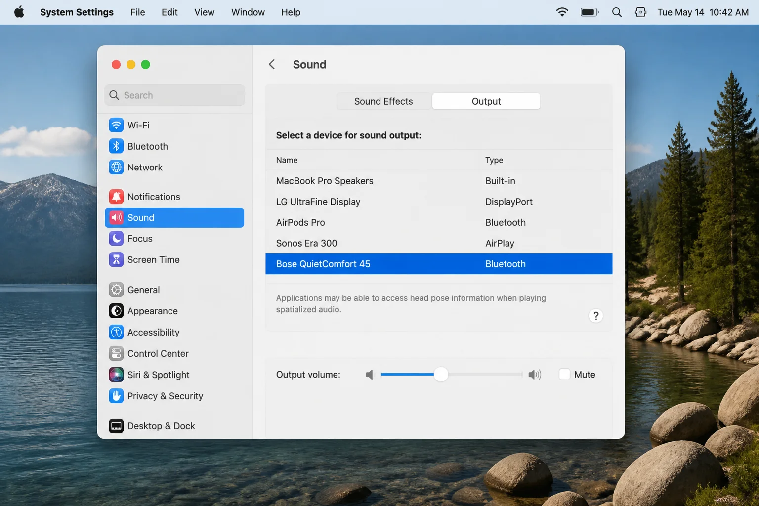 macOS System Settings > Sound > Output tab showing the selected audio output device and volume slider