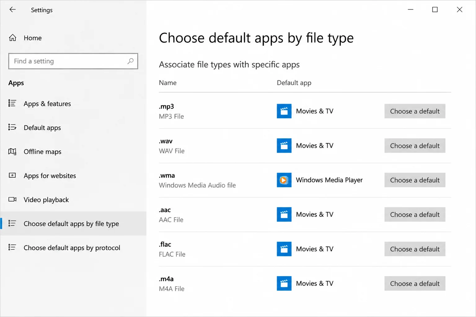 Windows Default apps area showing a common audio or video file type, its current app, and the control for choosing another app