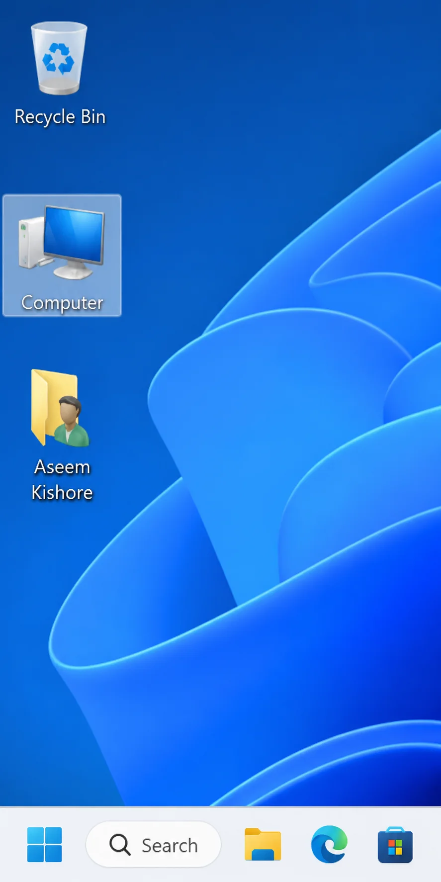 Windows desktop with icons for Recycle Bin, Computer, and a user folder named Aseem Kishore.