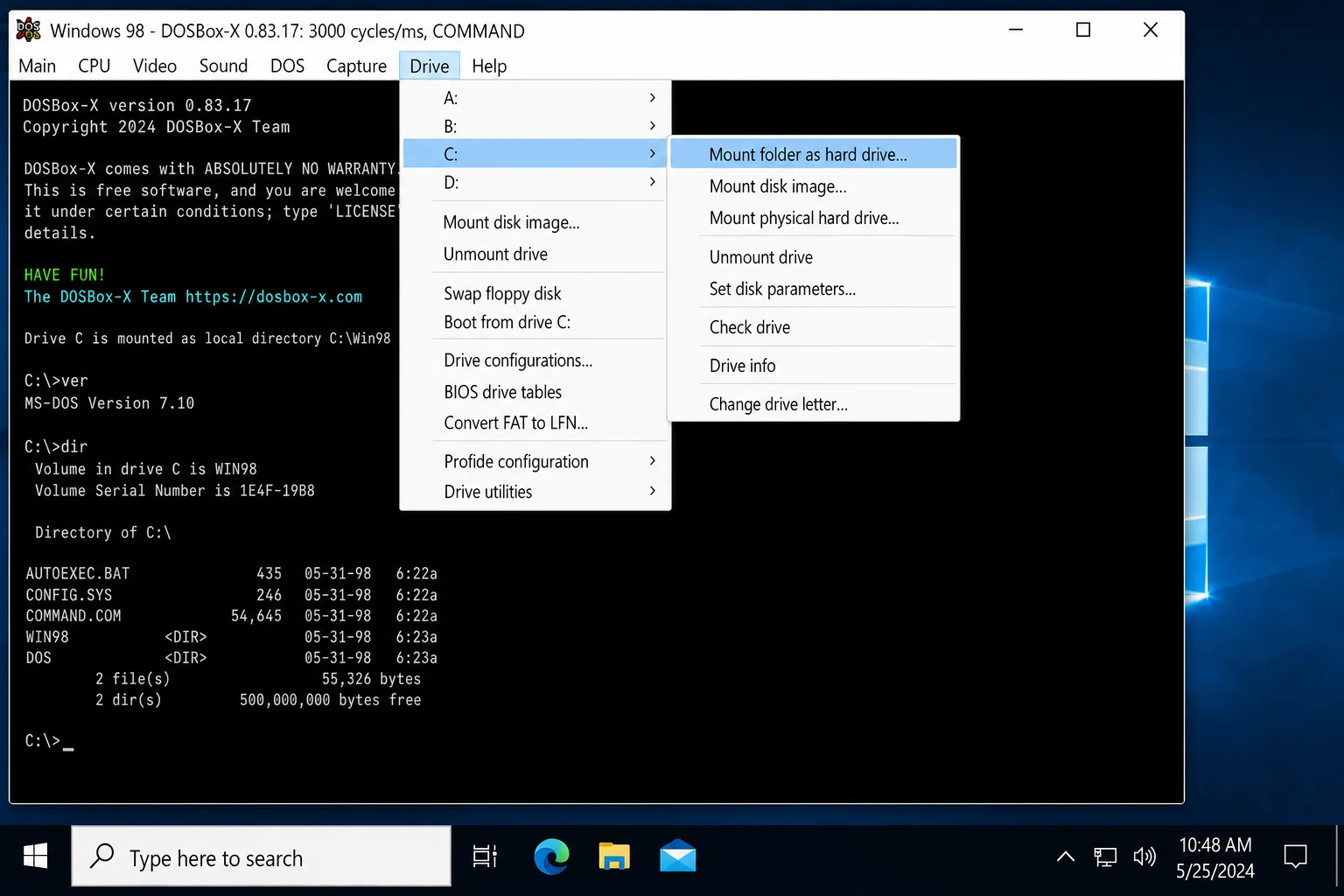 DOSBox-X window with the Drive menu open, showing "C → Mount folder as hard drive…" option highlighted