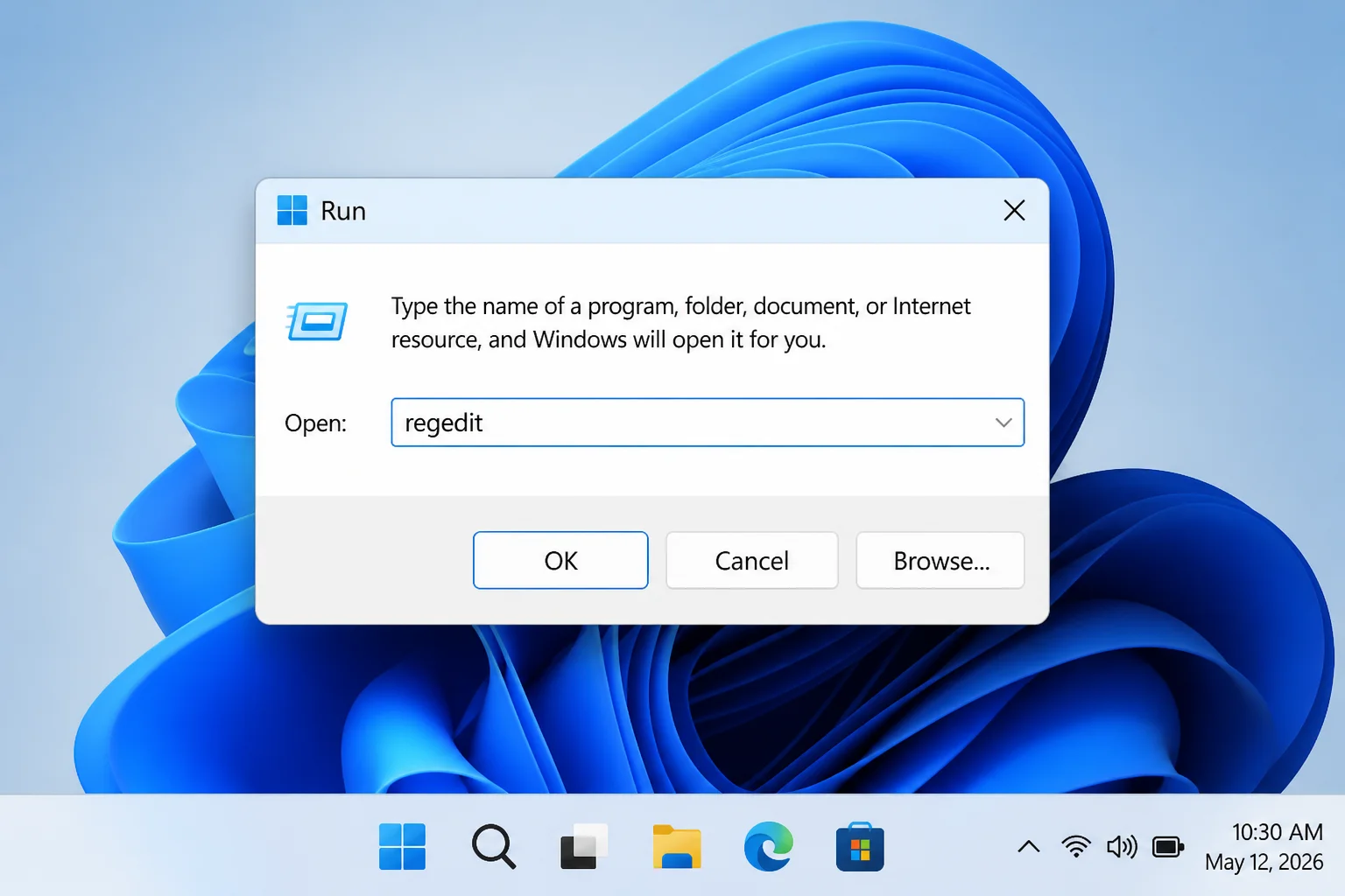 Windows 11 Run dialog with regedit entered in the Open field