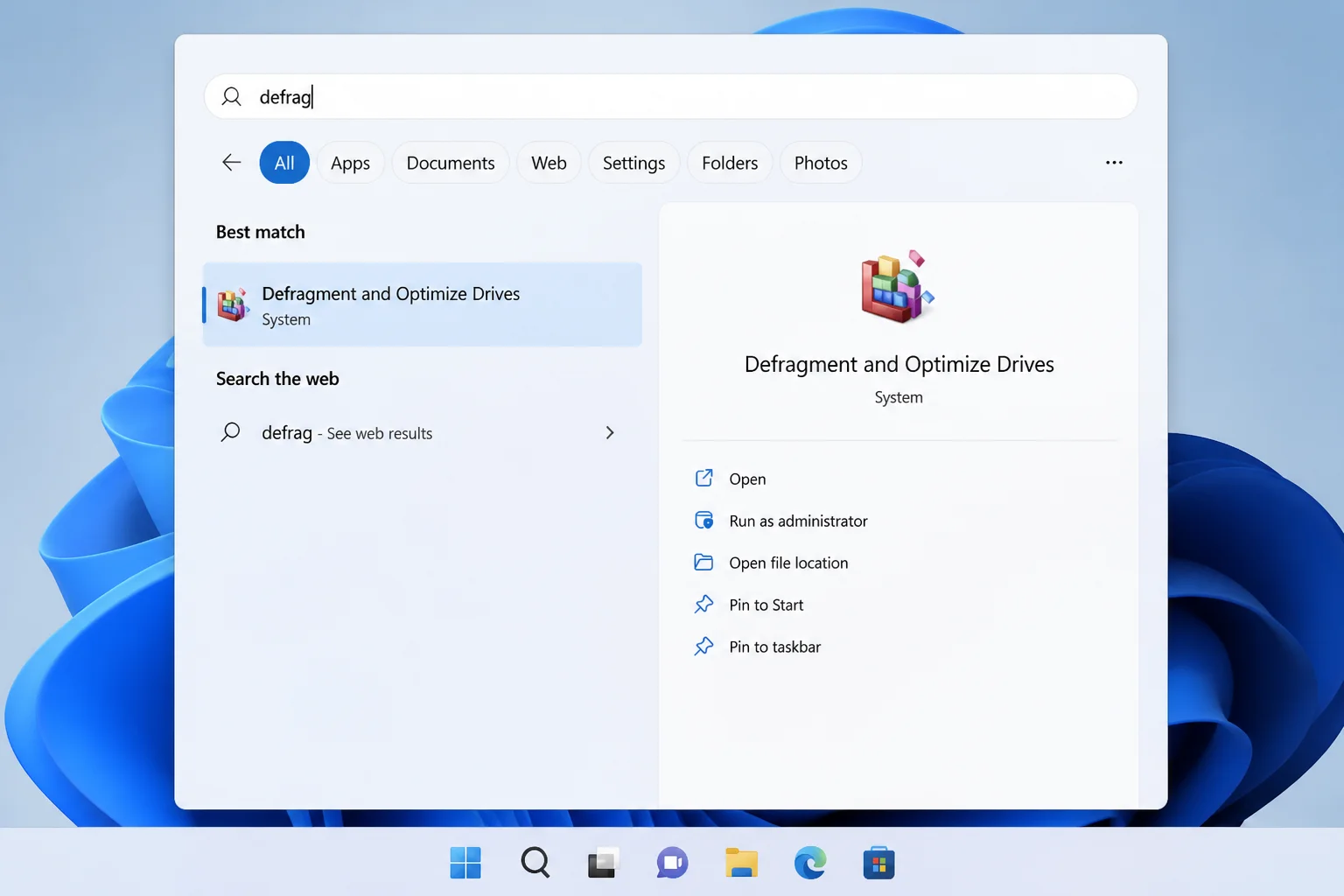 Windows 11 taskbar search with "defrag" typed, showing "Defragment and Optimize Drives" as the top result