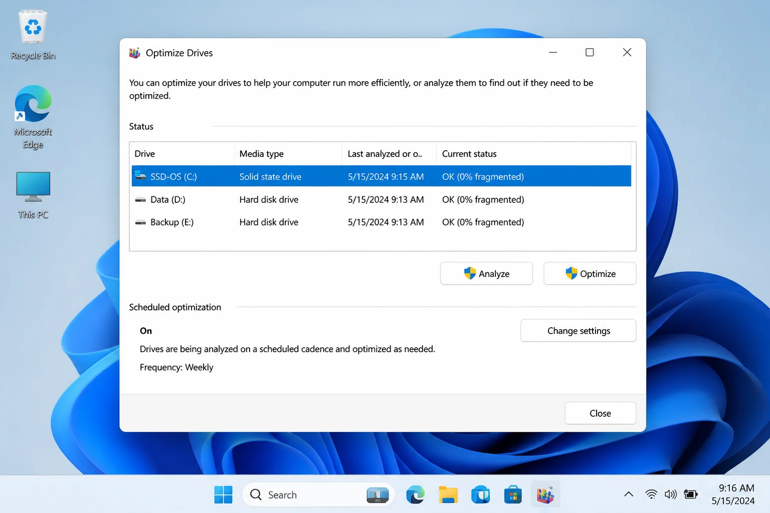 Windows 11 File Explorer showing a drive's Properties dialog open on the Tools tab, with the Optimize button highlighted under "Optimize and defragment drive"