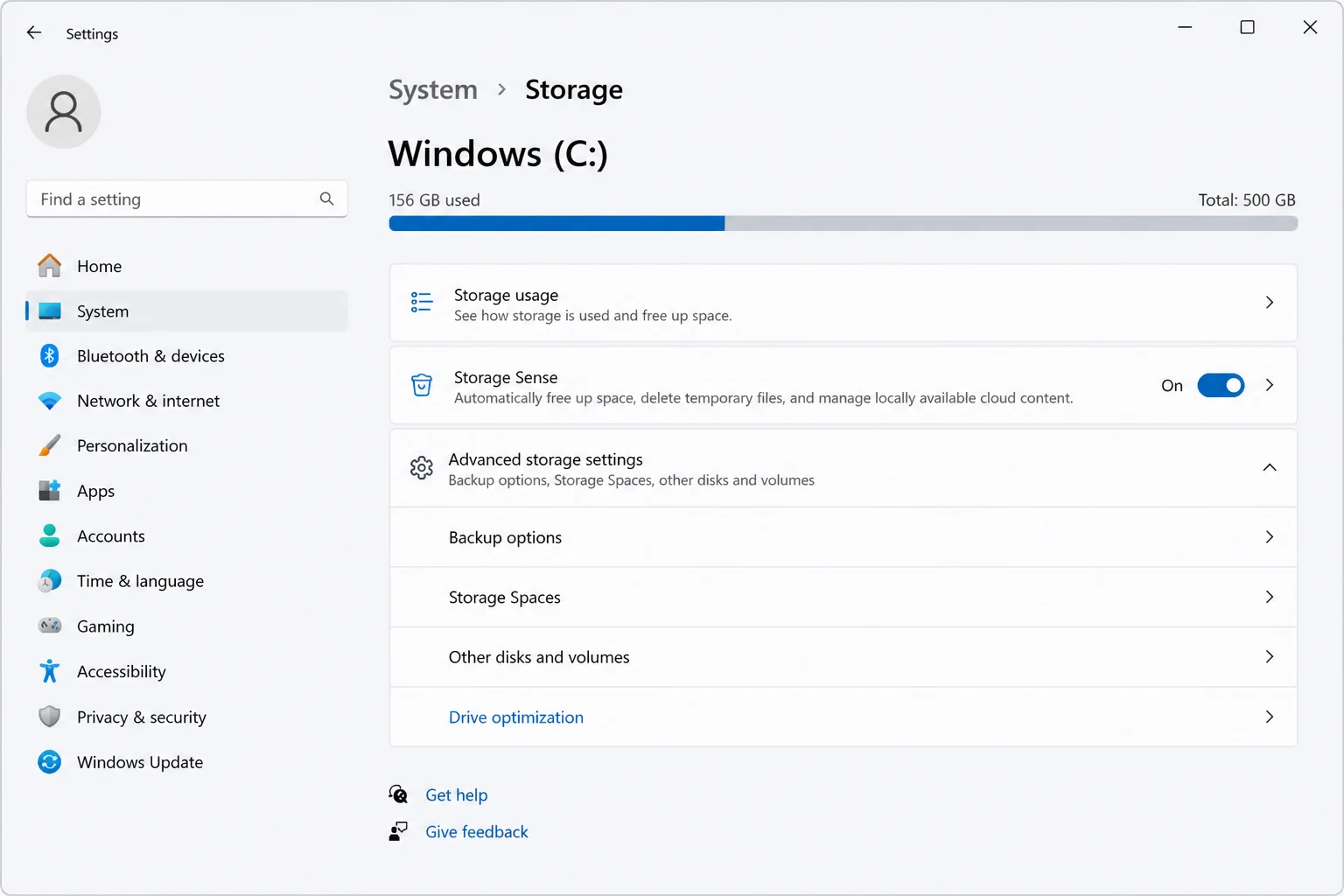 Windows 11 Settings app showing System > Storage with "Advanced storage settings" section expanded and "Drive optimization" link visible