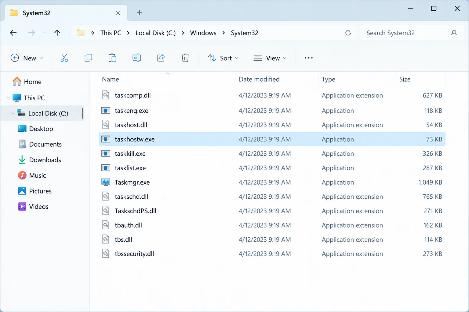 File Explorer showing taskhostw.exe selected inside C:\Windows\System32, address bar visible